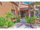 Charming front entrance of a southwest-style home with desert landscaping and a tiled roof at 13914 E Laurel Ln, Scottsdale, AZ 85259