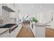 Open-concept kitchen with an island, high-end appliances, and hardwood flooring at 13914 E Laurel Ln, Scottsdale, AZ 85259