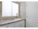 Stylish powder room with decorative wallpaper, granite countertop and under-mount sink at 13914 E Laurel Ln, Scottsdale, AZ 85259
