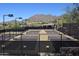 Well-maintained tennis courts with lighting and mountain views at 13914 E Laurel Ln, Scottsdale, AZ 85259
