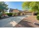Beautiful home with a manicured lawn, mature trees, and a spacious driveway at 15272 W Georgia Dr, Surprise, AZ 85379
