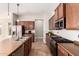 Spacious kitchen with stainless steel appliances, center island, and plenty of counter space at 15272 W Georgia Dr, Surprise, AZ 85379