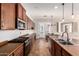 Well-equipped kitchen features modern appliances, ample cabinetry, and a breakfast bar area at 15272 W Georgia Dr, Surprise, AZ 85379