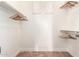 Walk-in closet featuring multiple rods and shelves for optimal organization at 15272 W Georgia Dr, Surprise, AZ 85379