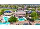 Picturesque aerial view of homes with backyard pools and solar panels in a well-maintained community at 15725 W Yucatan Dr, Surprise, AZ 85379