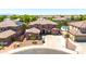 Aerial view of a two-story home with tile roof, desert landscaping, and close proximity to neighboring homes at 15725 W Yucatan Dr, Surprise, AZ 85379