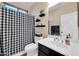 Bright bathroom with a shower featuring a black and white patterned curtain at 15725 W Yucatan Dr, Surprise, AZ 85379