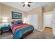Comfortable bedroom featuring a vibrant bedspread and stylish decor at 15725 W Yucatan Dr, Surprise, AZ 85379
