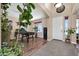 Inviting foyer featuring modern tile flooring, neutral walls, and a white entry door and a game table at 15725 W Yucatan Dr, Surprise, AZ 85379