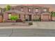 Charming front exterior showcases an inviting facade with desert landscaping and a two car garage at 15725 W Yucatan Dr, Surprise, AZ 85379
