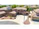 Aerial view of a well-maintained two-story home featuring a tile roof and manicured desert landscape at 15725 W Yucatan Dr, Surprise, AZ 85379