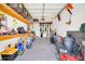 Organized garage space with ample storage, shelving, and room for vehicles and equipment at 15725 W Yucatan Dr, Surprise, AZ 85379