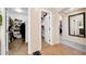 Hallway view of closets with shelving for ample storage at 15725 W Yucatan Dr, Surprise, AZ 85379