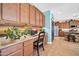Convenient workspace featuring built-in cabinets, a desk area, and a view of the kitchen at 15725 W Yucatan Dr, Surprise, AZ 85379