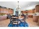 Lovely kitchen and dining area with granite countertops, a round table, and lots of cabinet space at 15725 W Yucatan Dr, Surprise, AZ 85379