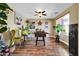An eclectic living room with a foosball table, ample plants, colorful wall art, and a safe at 15725 W Yucatan Dr, Surprise, AZ 85379