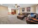 Upstairs living room boasts a large leather sofa, ottoman and movie posters at 15725 W Yucatan Dr, Surprise, AZ 85379