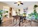 An eclectic living room with a foosball table, lush plants, and a staircase leading to the second floor at 15725 W Yucatan Dr, Surprise, AZ 85379