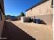 A large and private backyard featuring a storage shed and block wall fencing at 15939 W Post Dr, Surprise, AZ 85374