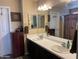Well-lit bathroom featuring a dual-sink vanity and modern fixtures at 15939 W Post Dr, Surprise, AZ 85374
