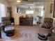Comfortable living room featuring plush seating and a console television at 15939 W Post Dr, Surprise, AZ 85374