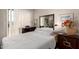 Relaxing bedroom with a comfy bed, closet, large mirror, and sliding glass door to a balcony at 1618 N 32Nd St # 5, Phoenix, AZ 85008