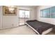 Comfortable bedroom featuring a sliding glass door to the balcony, carpeted floor, and art at 1618 N 32Nd St # 5, Phoenix, AZ 85008