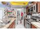 Galley kitchen with updated stainless steel appliances and modern countertops at 1618 N 32Nd St # 5, Phoenix, AZ 85008