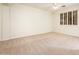 Bright bedroom with natural light, carpet floors, and ceiling fan at 16515 N 71St Dr, Peoria, AZ 85382