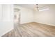 Bright dining room featuring wood-look floors and decorative lighting fixture at 16515 N 71St Dr, Peoria, AZ 85382