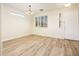 Inviting entryway featuring wood-look floors, modern lighting and large window at 16515 N 71St Dr, Peoria, AZ 85382