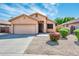 Charming single story home with landscaped yard and two car garage at 16515 N 71St Dr, Peoria, AZ 85382