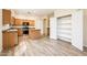 Modern kitchen with stainless steel appliances, island, and bright lighting at 16515 N 71St Dr, Peoria, AZ 85382