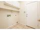 Bright Laundry Room with tile floor and utility sink hookups at 16515 N 71St Dr, Peoria, AZ 85382