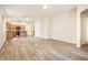 Open-concept floor plan showcasing living area and kitchen with stainless steel appliances at 16515 N 71St Dr, Peoria, AZ 85382