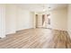 Bright and airy living room featuring wood-look flooring and a ceiling fan at 16515 N 71St Dr, Peoria, AZ 85382