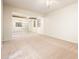 Spacious main bedroom with mirrored closet doors, ceiling fan, and carpet floors at 16515 N 71St Dr, Peoria, AZ 85382