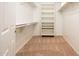 Walk-in closet with carpeted floor, ample shelving and hanging space at 16515 N 71St Dr, Peoria, AZ 85382