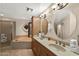 Luxurious bathroom with a double vanity, soaking tub, and glass-enclosed shower at 1934 E Cypress Tree Dr, Gilbert, AZ 85234