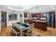 Open kitchen and dining area with stainless steel appliances and modern lighting at 1934 E Cypress Tree Dr, Gilbert, AZ 85234