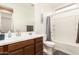 Bathroom with vanity, mirror, shower and tub combination at 19627 W Badgett Ln, Litchfield Park, AZ 85340