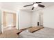 Bedroom featuring neutral walls, ceiling fan, and an attached door to a dog run at 19627 W Badgett Ln, Litchfield Park, AZ 85340