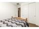 Bedroom featuring a wooden bed frame, carpet, closet with sliding doors at 19627 W Badgett Ln, Litchfield Park, AZ 85340