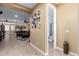 Hallway view showcases open floorplan connecting living spaces and a glimpse into an adjacent bathroom at 19627 W Badgett Ln, Litchfield Park, AZ 85340