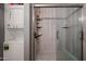 Bathroom featuring a walk-in shower and convenient in-unit washer and dryer at 205 N 74Th St # 201, Mesa, AZ 85207