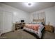 Cozy bedroom with carpet, simple furnishings, and natural light, creating a peaceful retreat at 205 N 74Th St # 201, Mesa, AZ 85207