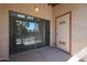 A private patio featuring a sliding glass door and an external storage closet at 205 N 74Th St # 201, Mesa, AZ 85207
