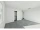 Light-filled bedroom featuring a large window, closet, and plush carpeting at 22375 S Manzanilla Rd, Buckeye, AZ 85326