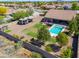 Aerial view of the backyard with a pool, hot tub, patio seating, and RV parking at 226 W Crimson Sky Ct, Casa Grande, AZ 85122