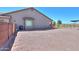 Large backyard featuring gravel, ideal for parking, outdoor activities, or potential landscaping projects at 226 W Crimson Sky Ct, Casa Grande, AZ 85122